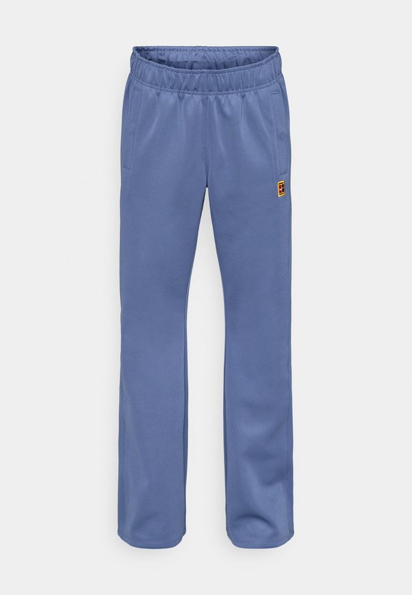 Nike Performance NIKECOURT PANT HERITAGE - Tracksuit bottoms - diffused blue