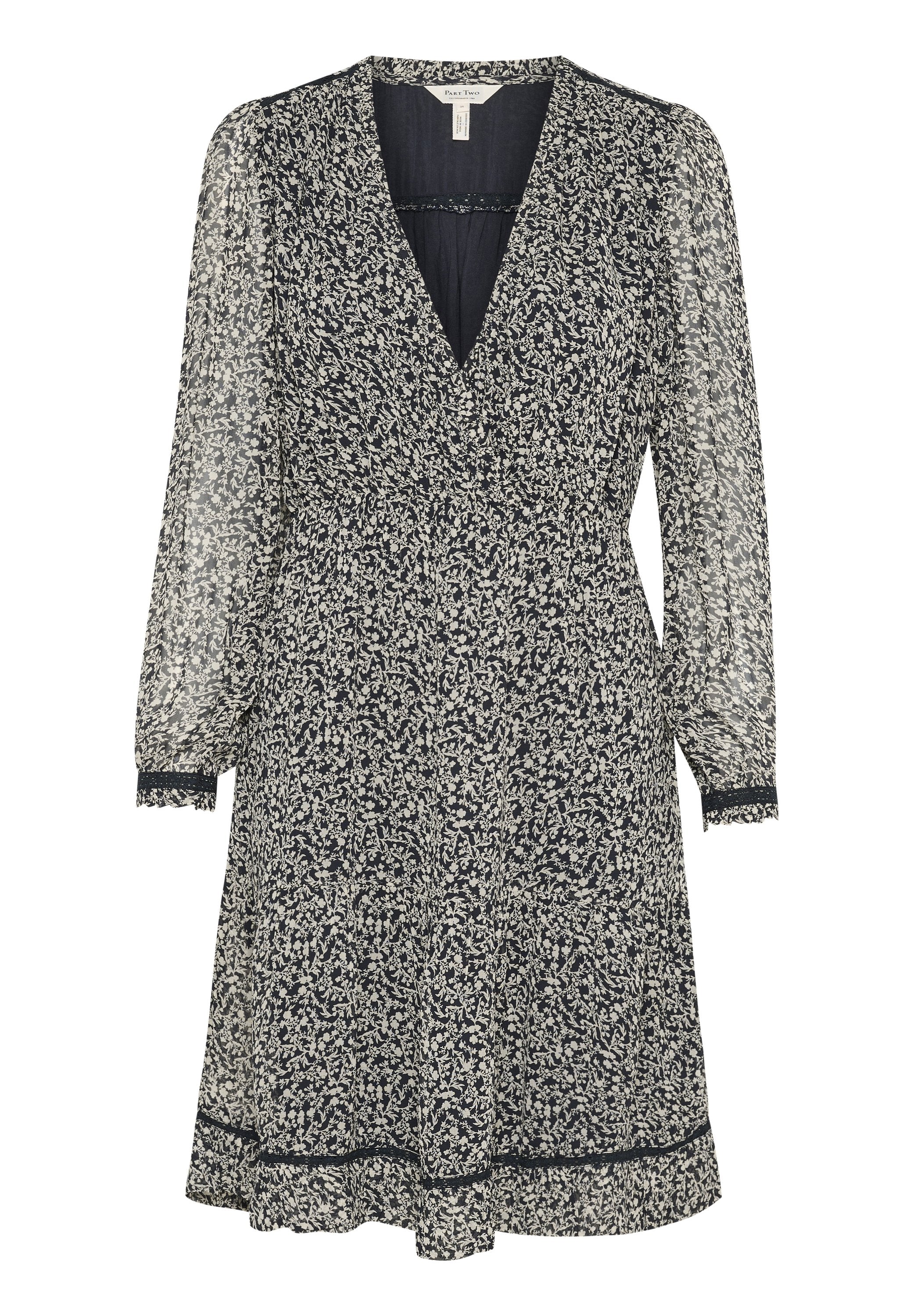 Navyblaues Kleid mit floralem Design, langen transparenten Ärmeln, V-Ausschnitt und gerafftem Taillenbereich. Mit Rüschensaum und kontrastierenden Abschlüssen.