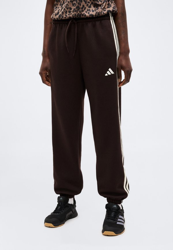 adidas Sportswear ESSENTIALS 3 STRIPES LOOSE PANTS - Tracksuit bottoms - aurora coffee/ivory