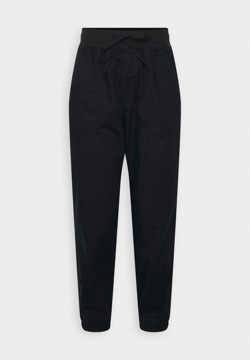 Schwarze leichte Hose mit einem elastischen Bund und Kordelzug, seitlichen Taschen, schmal zulaufenden Beinen und elastischen Bündchen an den Knöcheln.