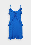 Blaues ärmelloses Kleid aus strukturiertem Stoff, mit Rüschenausschnitt und -saum sowie einem ausgestellten Schnitt. Keine sichtbaren Verschlüsse oder Muster.