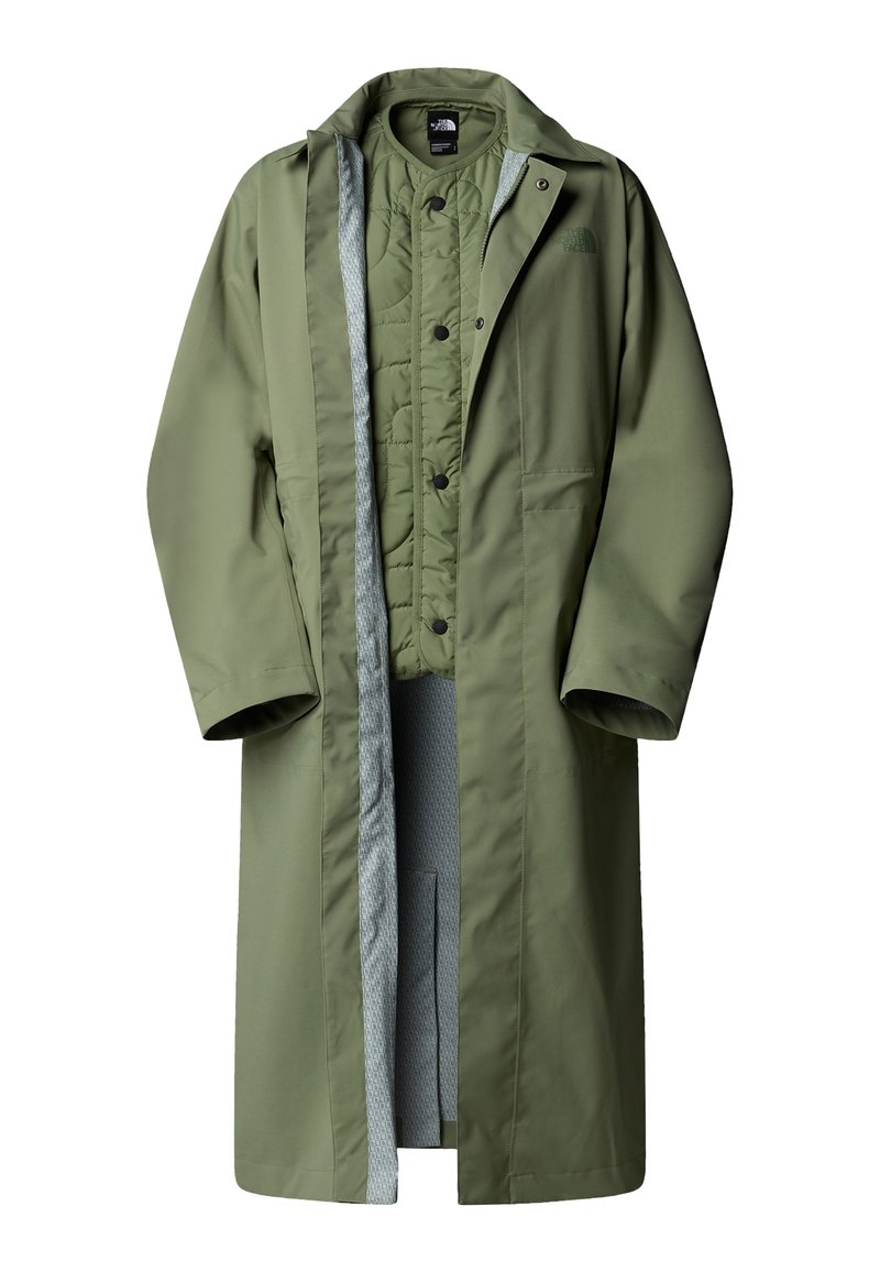 Olivegrüner langer Mantel mit Reißverschluss und Druckknopfverschluss. Verfügt über eine graue, gesteppten Innenfutter und seitliche Taschen. Glattes, wasserabweisendes Material.
