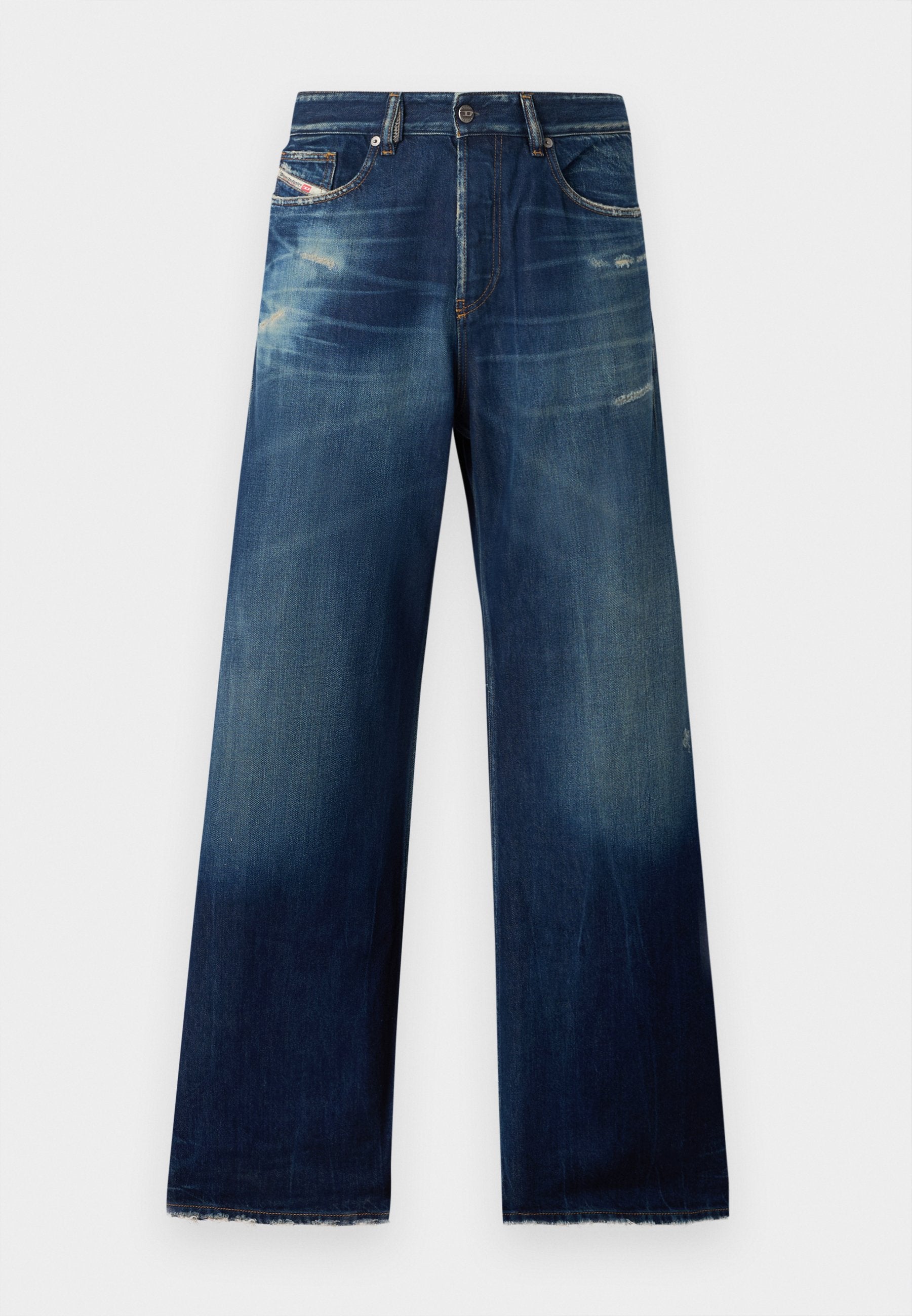 Weite Jeans aus Denim in Dunkelblau mit ausgebleichten Stellen, abgenutzten Details und fransigen Säumen. Vier Taschen und ein Knopfverschluss.