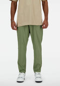 New Balance AC STRETCH REGULAR - Tracksuit bottoms - dark olivine