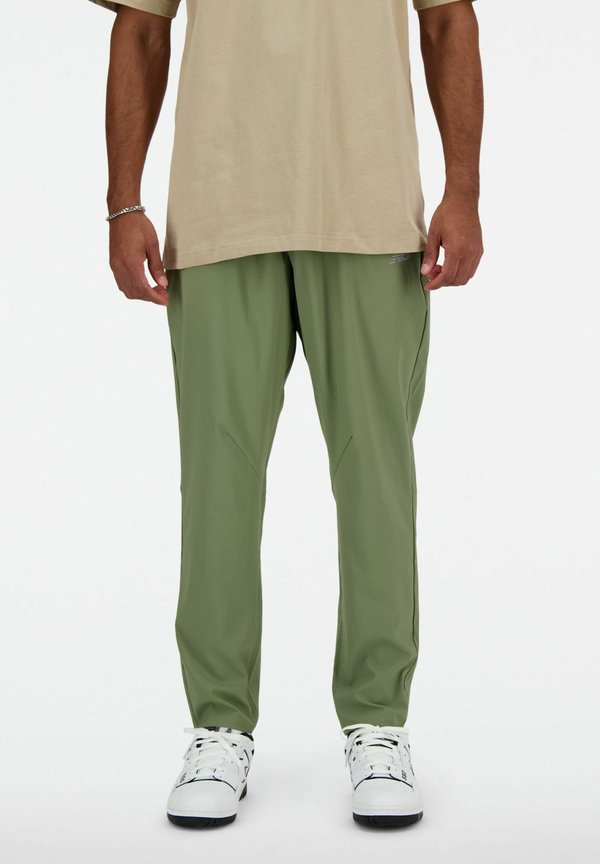 New Balance AC STRETCH REGULAR - Tracksuit bottoms - dark olivine