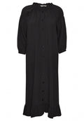 Schwarzes Leinenkleid mit einem Rüschenausschnitt, drei Viertelärmeln, einer durchgehenden Knopfleiste und einem ausgestellten Saum mit Rüsche.