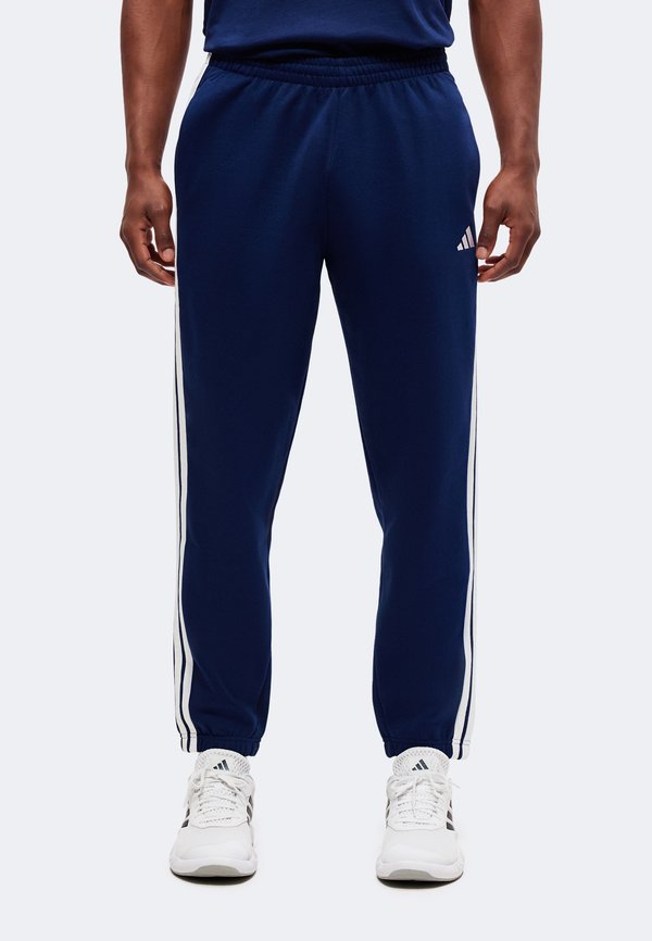 adidas Sportswear ESSENTIALS 3 STRIPES TAPERED CUFFED PANTS - Tracksuit bottoms - team navy blue 2/white