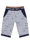 Gestreifte Kinderhose in Marineblau und Weiß mit Marineblauen Bündchen, Tiermotiven und Timberland-Logo am Bund und auf dem Stoff.