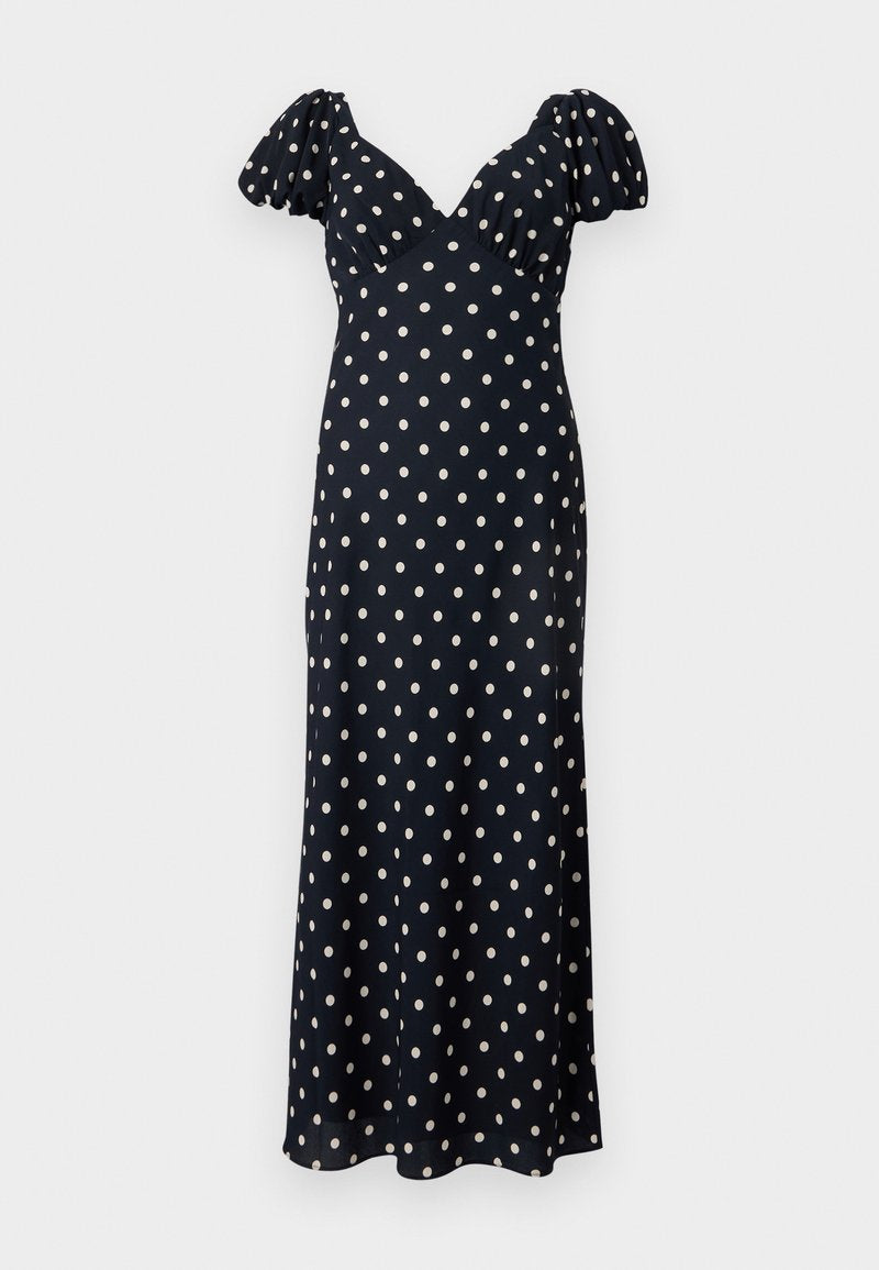 Navyblaues Kleid mit weißen Punkten. Verfügt über Puffärmel und einen V-Ausschnitt, hergestellt aus einem glatten Stoff. Ausgestellte Silhouette bis zur Knöchellänge.