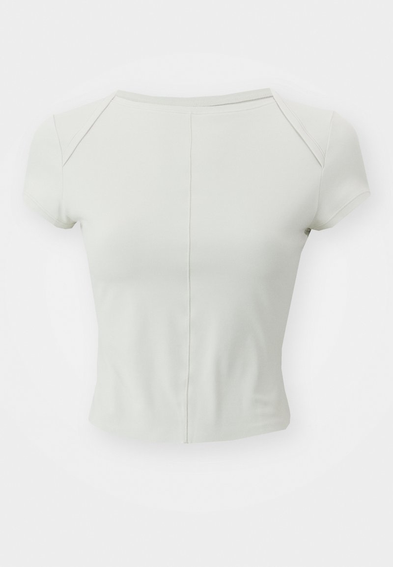 Figurbetontes Kurzarmoberteil in hellem Beige, aus einem weichen, dehnbaren Stoff; mit rundem Halsausschnitt und dezenten Nahtdetails.