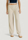 Beige Sporthose mit elastischem Bund, Seitenstreifen und kleinem Logo. Hergestellt aus glattem, leichtem Stoff.