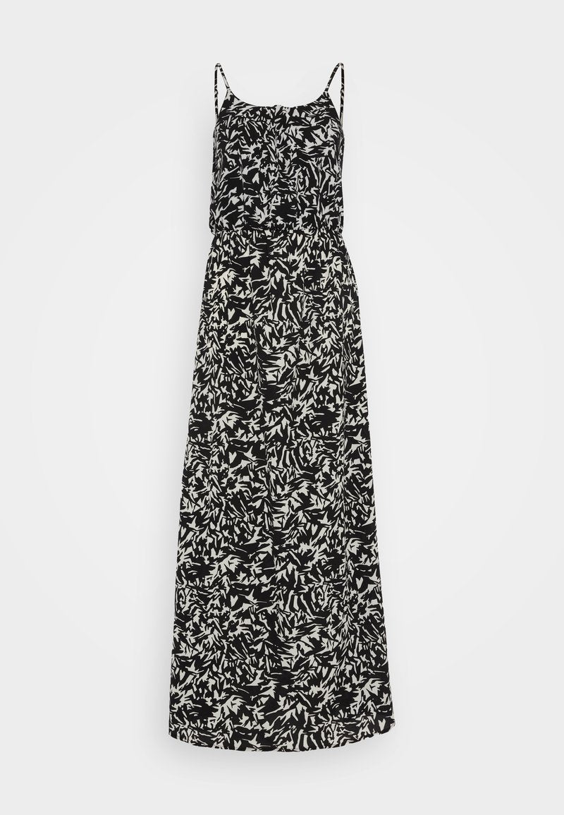 Maxikleid mit schwarz-weißen abstrakten Blattmustern, Spaghettiträgern, einem taillierten Oberteil und einem fließenden Rock. Hergestellt aus leichtem Stoff.