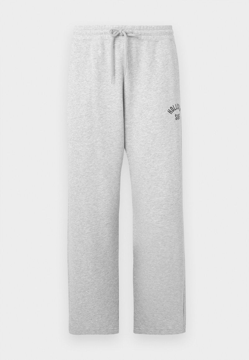 Helle graue Jogginghose mit elastischem Bund, Kordelzug, Seitentaschen und kleinem "Hollister Surf"-Logo auf der oberen linken Oberschenkel.