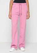 Rosa Jogginghose aus weichem Stoff, mit einem elastischen Bund und Kordelzügen, seitlichen Taschen und einem lockeren Schnitt.