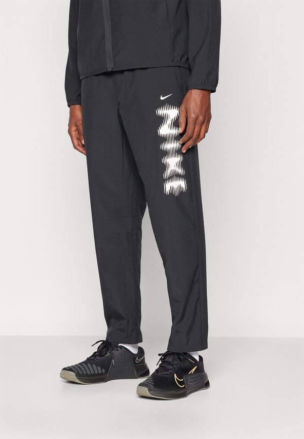 Nike Performance FORM - Tracksuit bottoms - black/white
