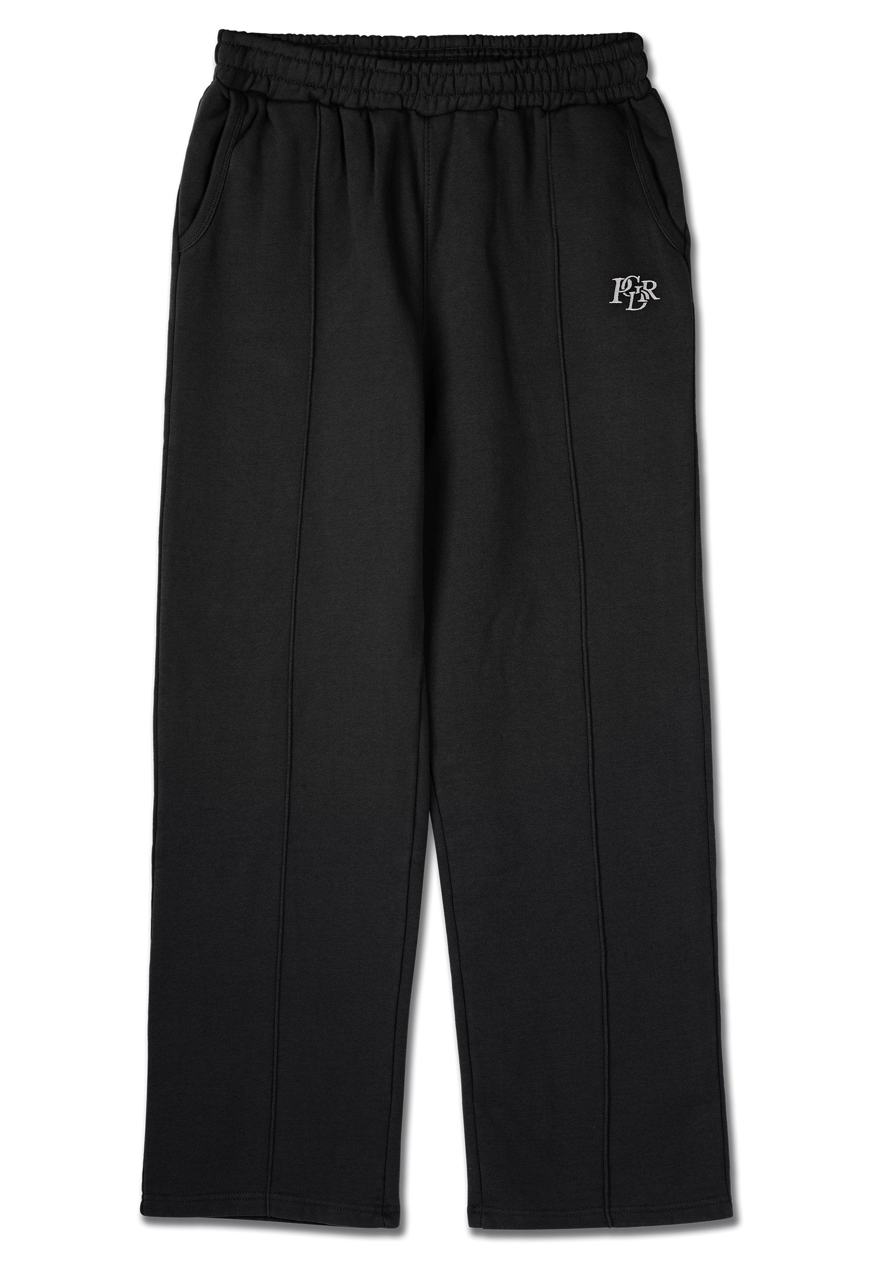 Schwarze Jogginghosen mit elastischem Bund, Seitentaschen und einem kleinen Logo am linken Oberschenkel. Aus weichem, strukturiertem Stoff gefertigt.