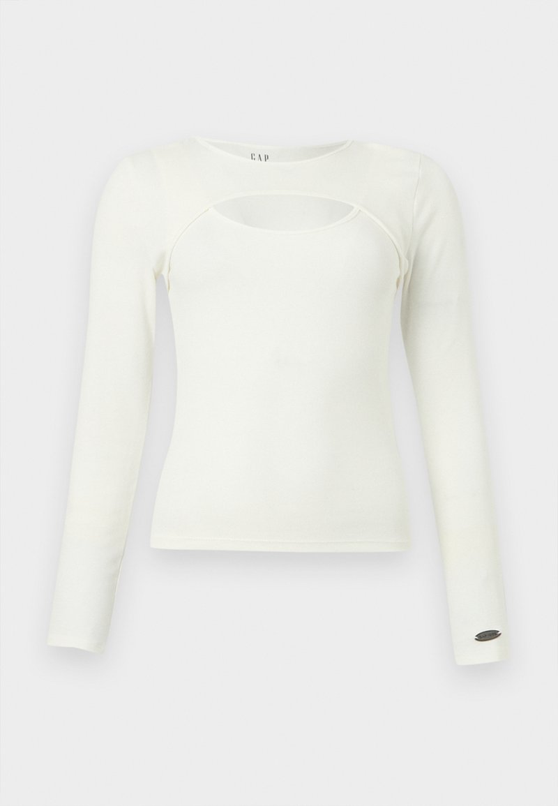 Weißes Langarmshirt für Damen mit rundem Ausschnitt vorne und einem kleinen Metalllogo am linken Ärmelbündchen.