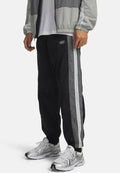 Under Armour ICON WOVEN TRACK - Tracksuit bottoms - black