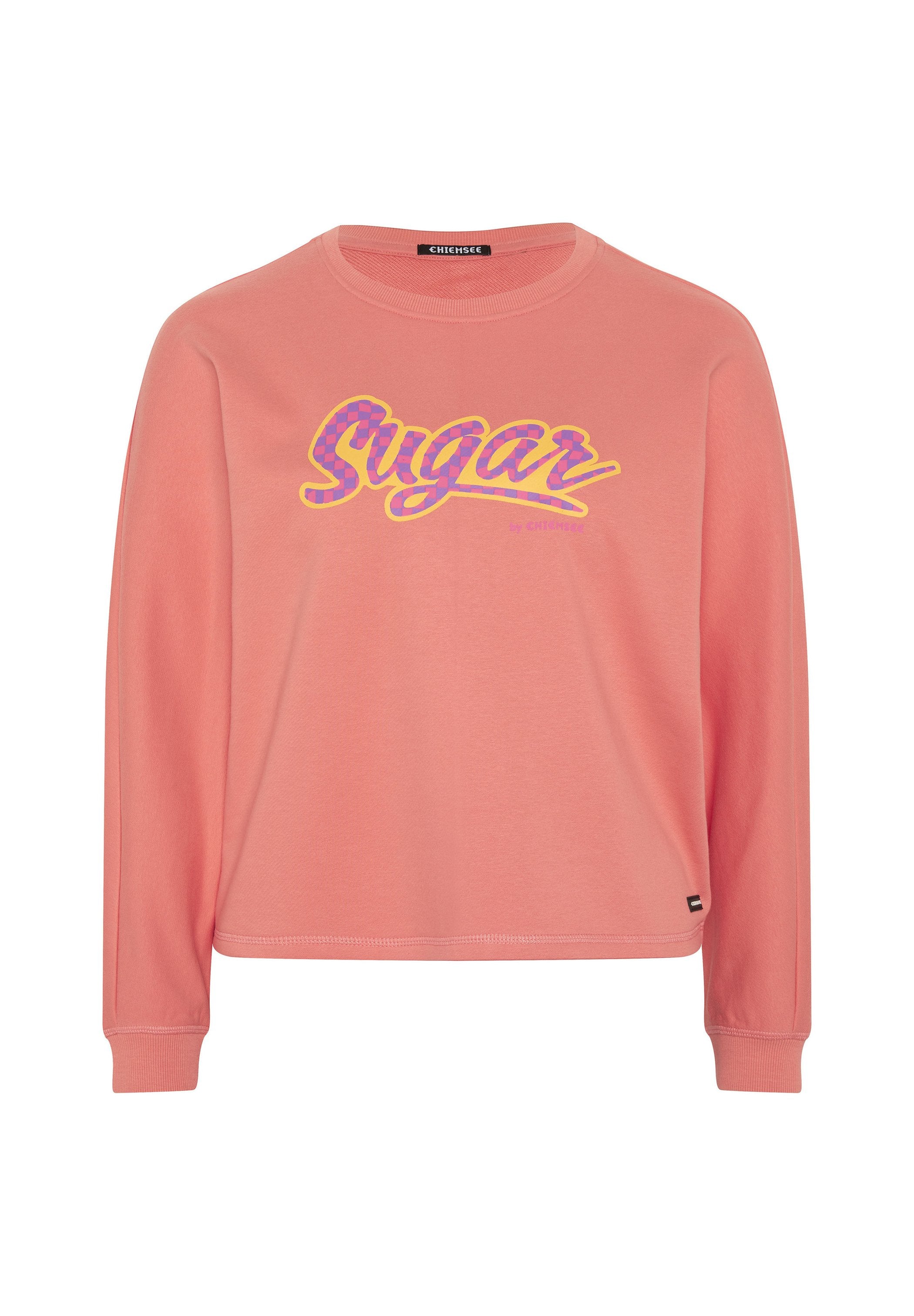 Rosa langärmliger Sweatshirt mit "Sugar" Grafik in Gelb und Lila. Verfügt über eine entspannte Passform, runden Halsausschnitt und gerippte Bündchen.