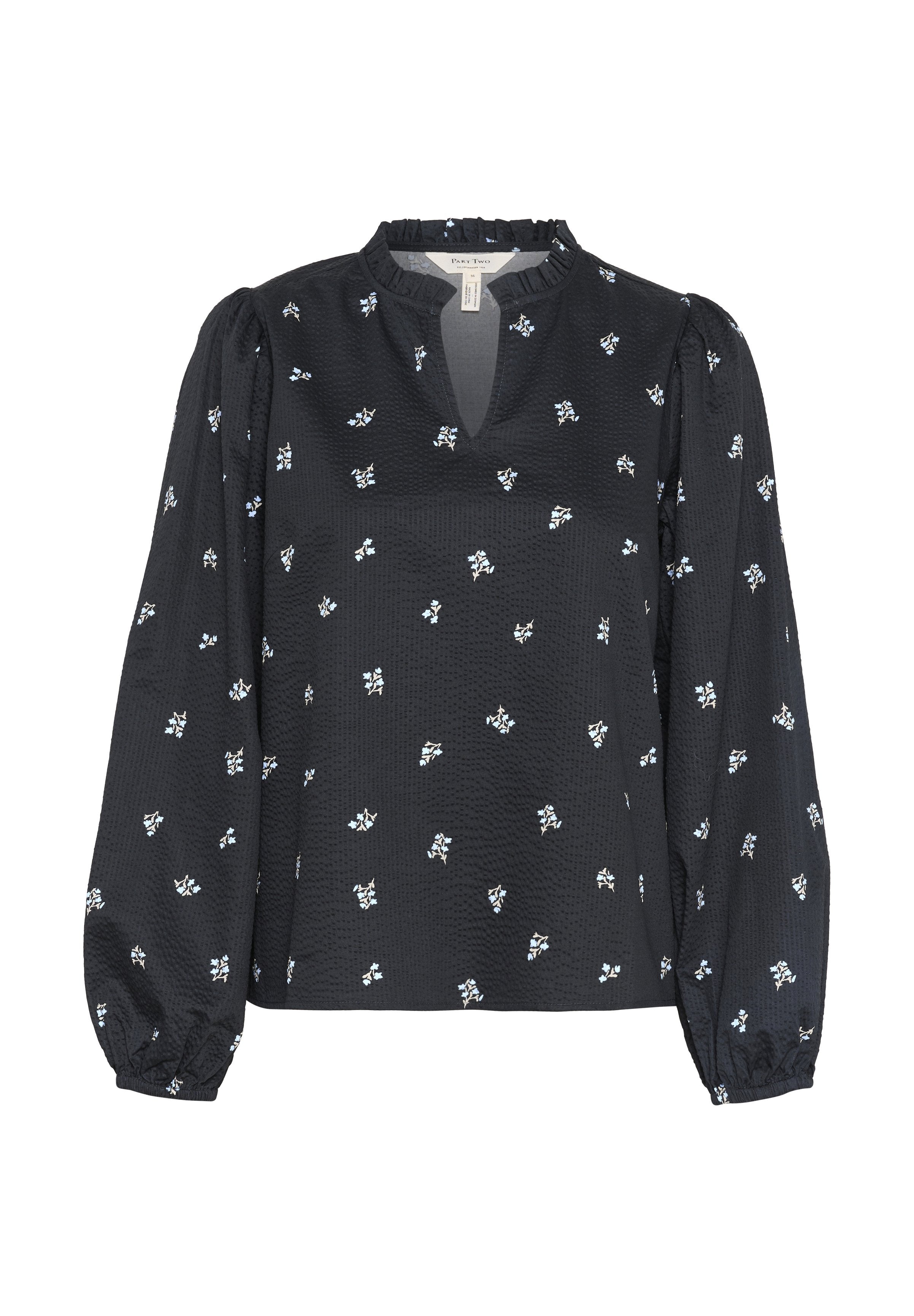 Schwarze Bluse aus strukturiertem Stoff, mit rundem Ausschnitt und puffartigen Ärmeln. Verziert mit kleinen weißen und hellblauen Blumenmustern.
