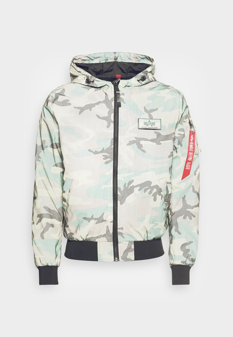Tarnschirm-Jacke in Hellgrün und Grau mit Reißverschluss, Kapuze, elastischen Bündchen und einem Markenpatch auf der Brust.