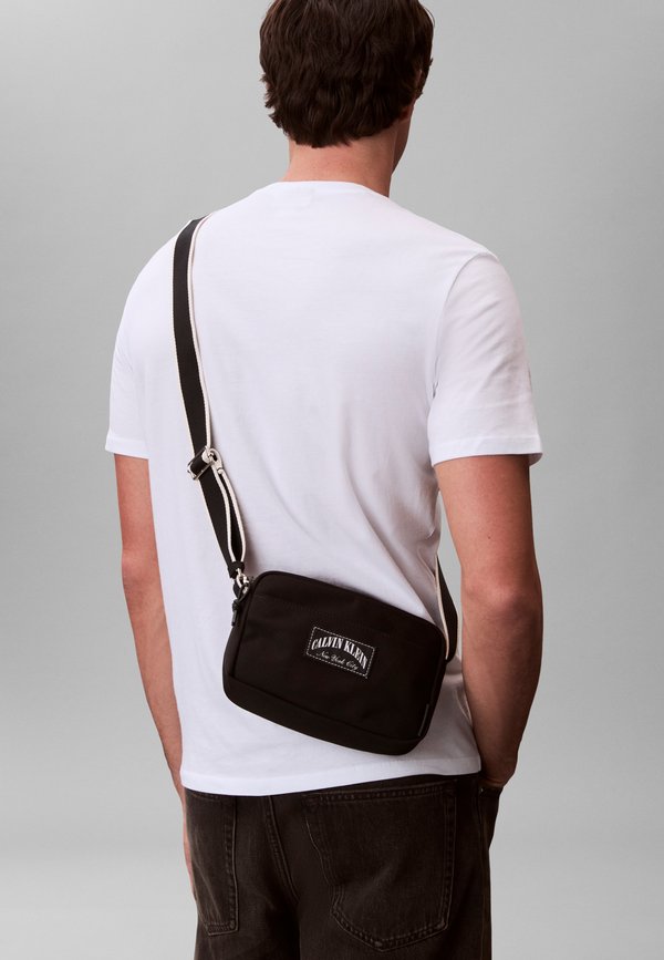 Calvin Klein CAPSULE - Cross body bag - black