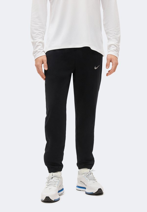 Nike Performance MILER - Tracksuit bottoms - black