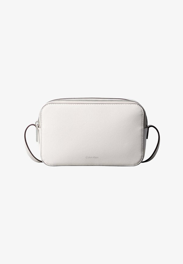 Calvin Klein FOIL LOGO ELONGATED CAMERA - Cross body bag - white alyssum