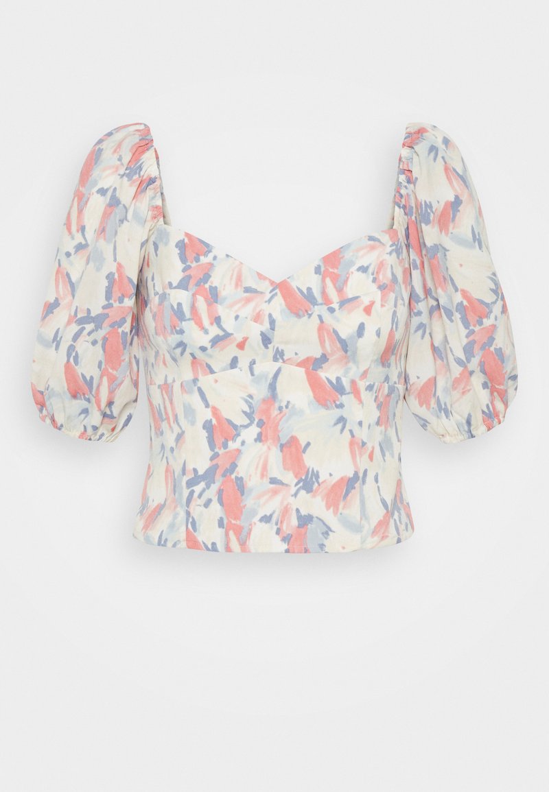 Bluse mit Blumenmuster und kurzen Puffärmeln. Hergestellt aus leichtem Stoff in Pastellfarben: Rosa, Blau und Creme. Eng anliegendes Oberteil mit Herz-Ausschnitt.
