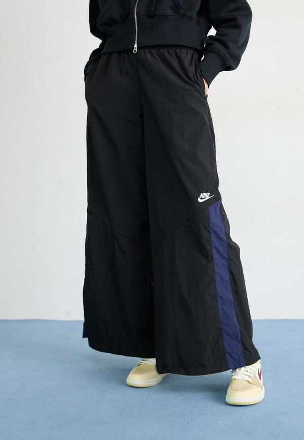 Nike Sportswear Tracksuit bottoms - black/midnight navy