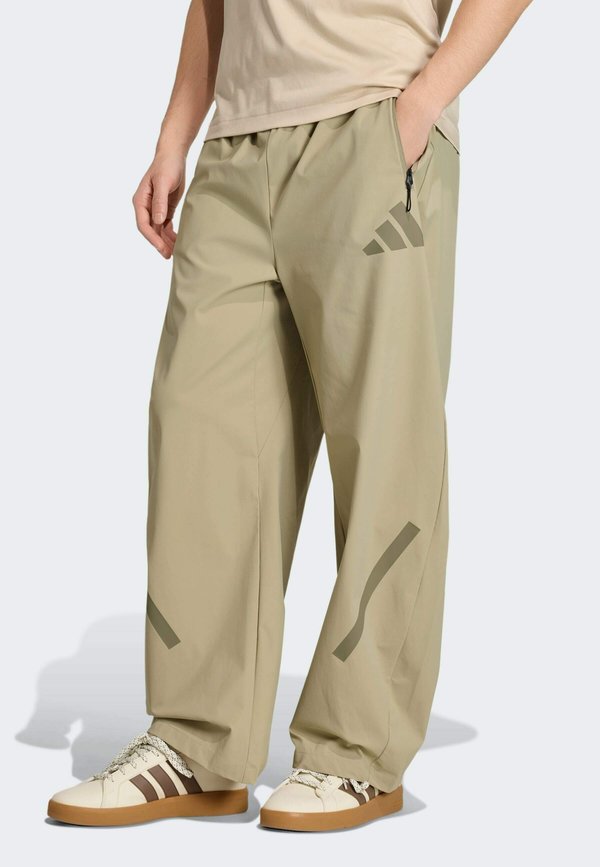adidas Sportswear ADIDAS Z.N.E. WOVEN - Tracksuit bottoms - beige