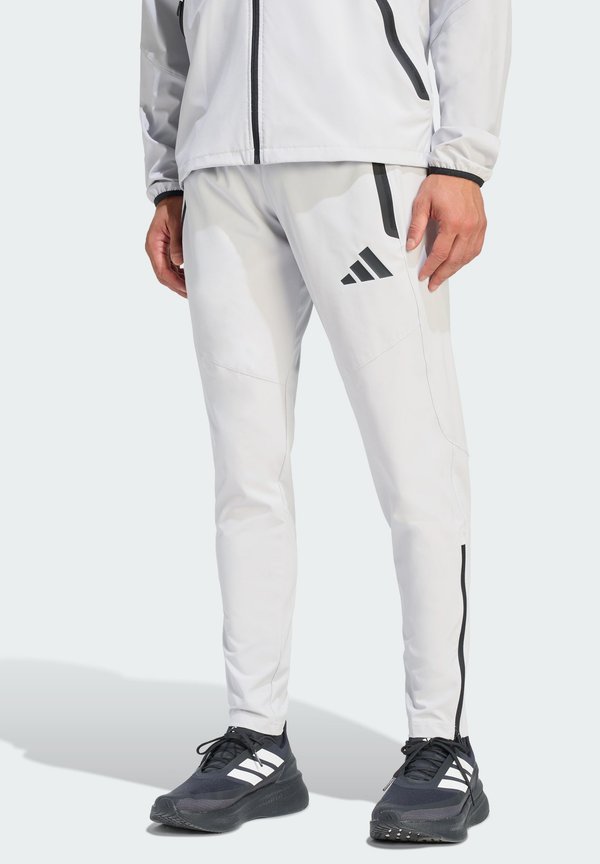 adidas Performance TIRO TRAVEL PANTS - Tracksuit bottoms - team light grey/black