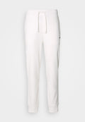 Weiße Baumwoll-Sweatpants mit einem elastischen Bund, Kordelzug und gerippten Bündchen. Mit einem kleinen schwarzen Logo an der Seite.