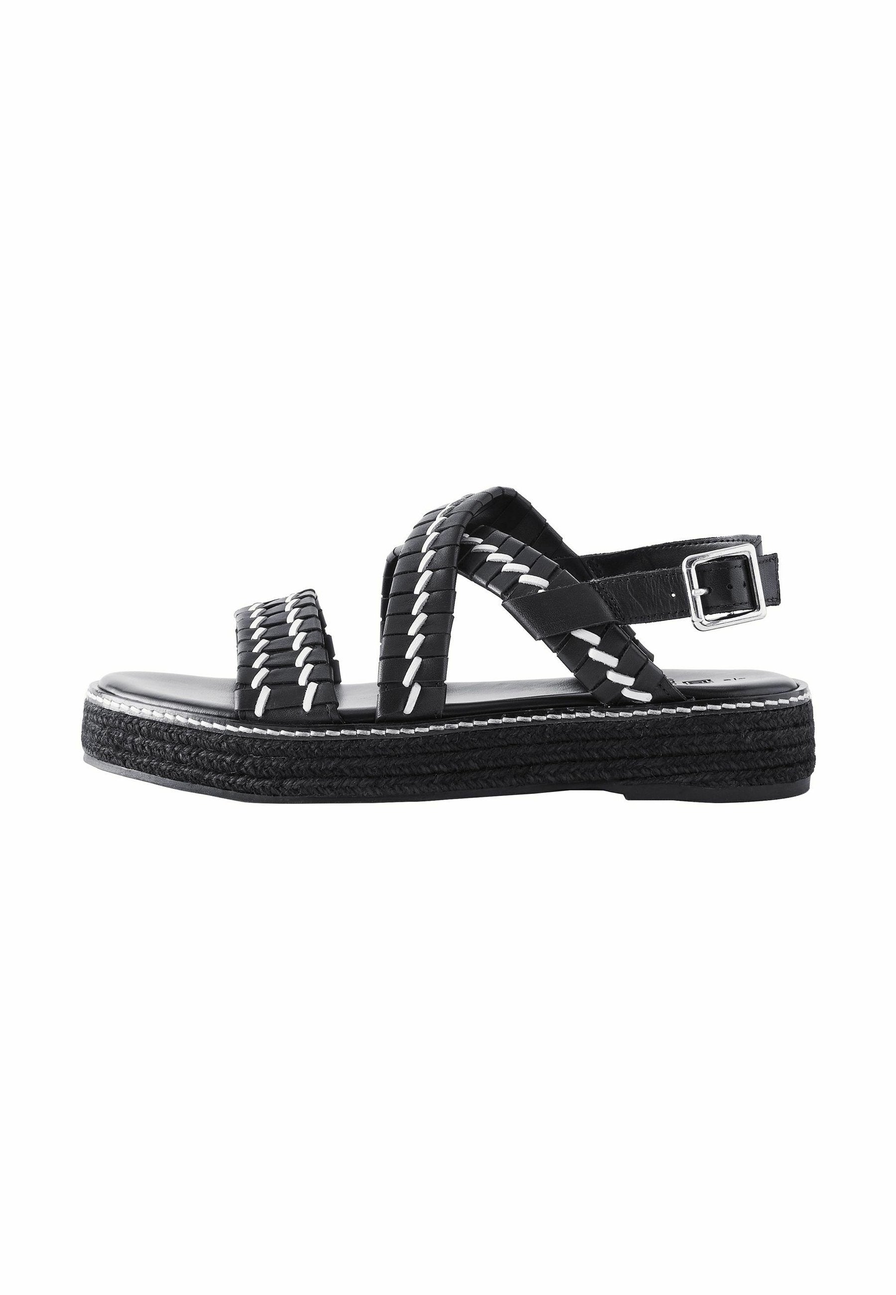 Schwarze geflochtene Ledersandalen mit einem verstellbaren Knöchelriemen, kontrastierenden weißen Nähten und einer robusten strukturierten Sohle.