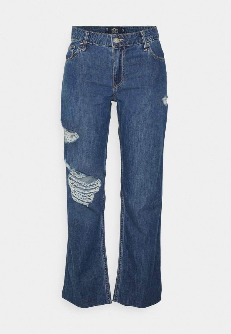 Blaue Jeans aus Denim im lässigen Schnitt mit ausgebesserten Knieflicken und abgesteppten Details. Mit Knopf- und Reißverschluss.