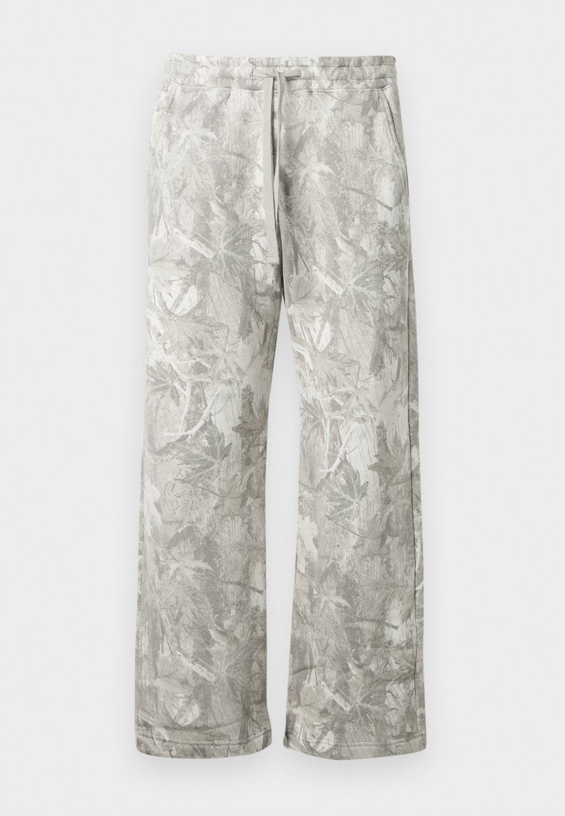 Helle graue Hose mit einem blättermuster, aus weichem Stoff gefertigt. Sie verfügt über einen elastischen Bund und gerade, weite Beine.