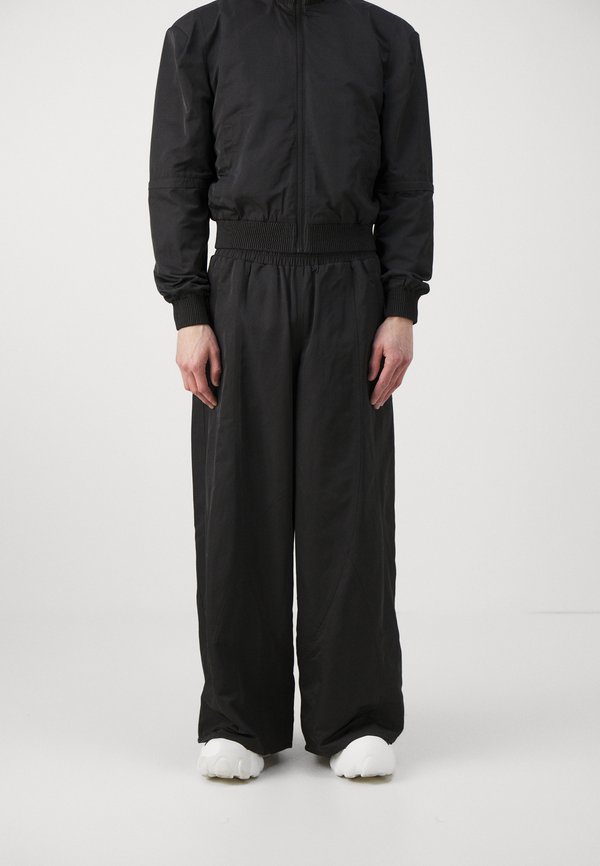 Han Kjøbenhavn OVERSIZED TRACK TROUSERS UNISEX
