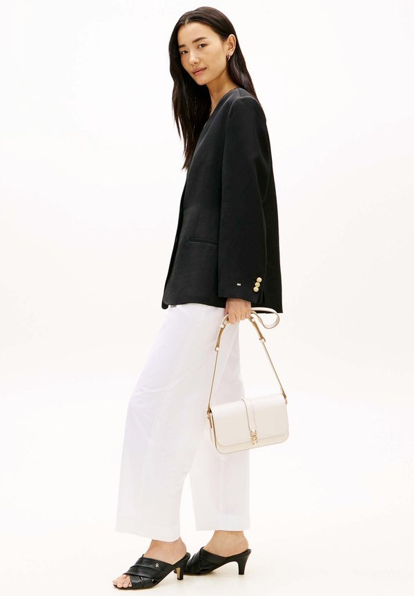 Tommy Hilfiger TH LIBRE FLAP CROSSOVER - Cross body bag - soft cream