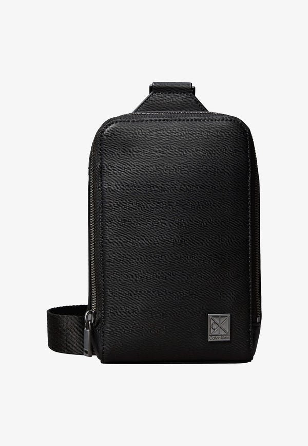 Calvin Klein EMBLEM SLING - Cross body bag - black