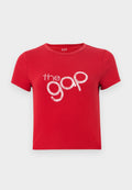 Rotes Baumwoll-T-Shirt mit kurzen Ärmeln, Rundhalsausschnitt und einem großen, weißen, glitzernden Textlogo "the gap" in der Mitte. Einfaches Design, keine Muster.