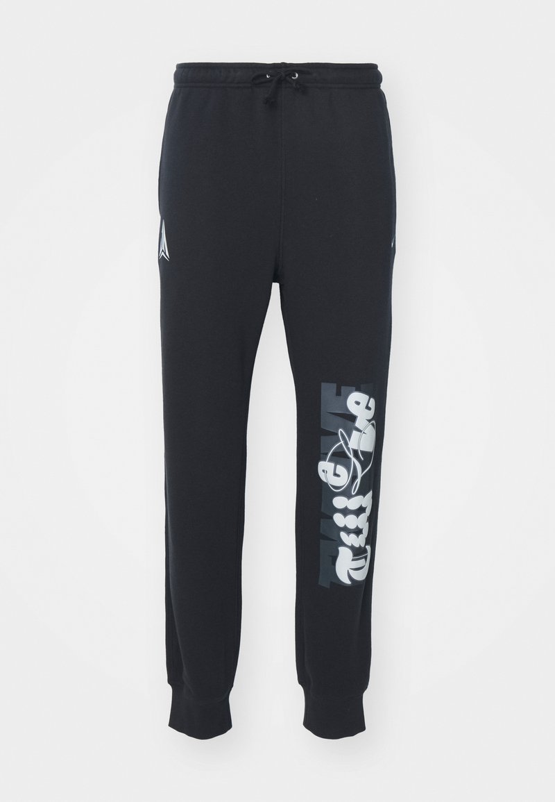 Schwarze Jogginghose mit elastischem Bund und Kordelzug, versehen mit weißen grafischen Designs entlang des linken Beins und gerippten Bündchen.