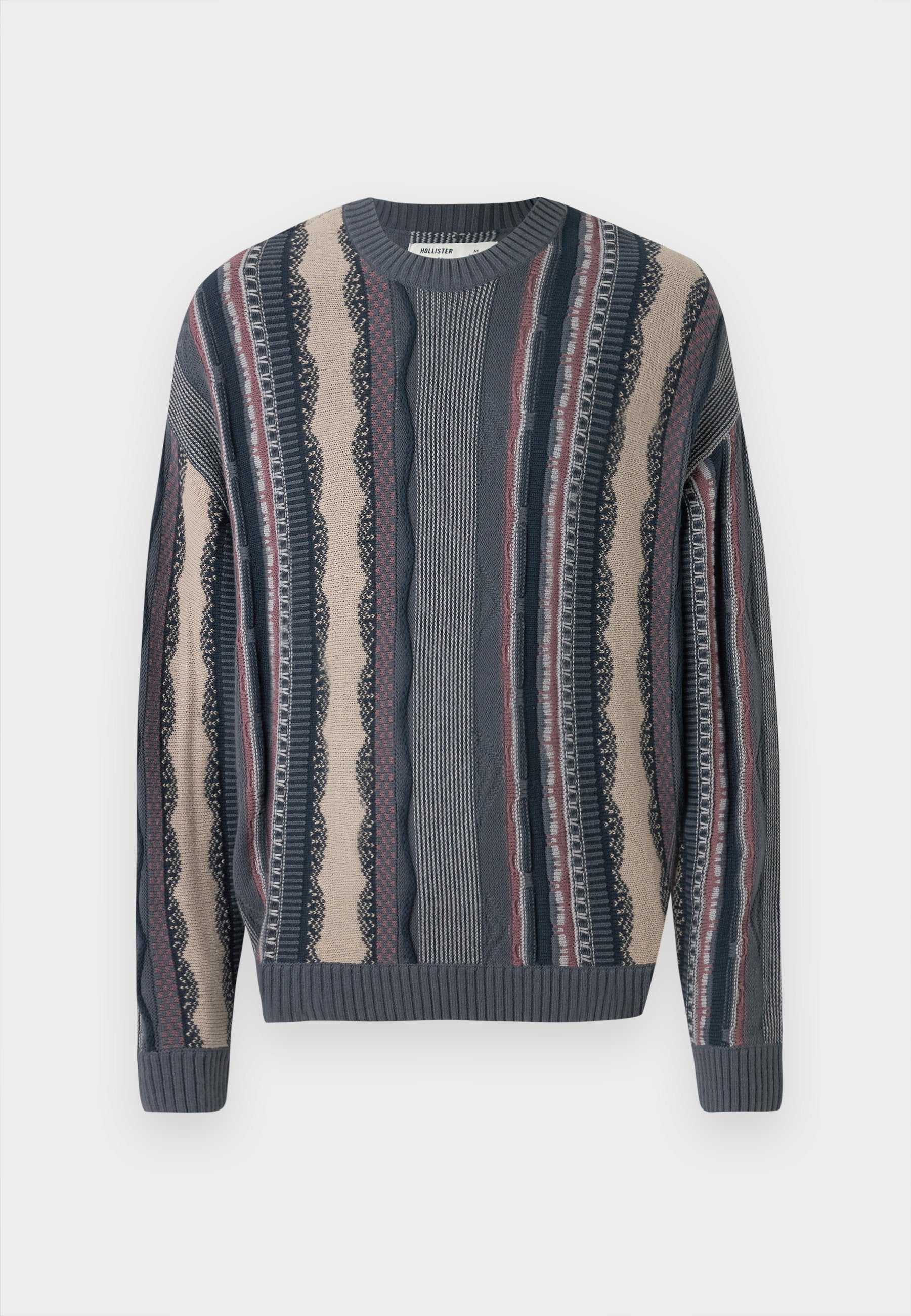 Strickpullover mit Rundhalsausschnitt, versehen mit wechselnden Streifen in Marineblau, Creme und Rot. Strukturierte Muster mit gerippten Bündchen und Saum.