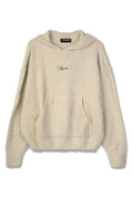 Flauschiger beiger Hoodie mit einer Fronttasche, gerippten Bündchen und einer Kapuze mit Kordelzug. Mit dem schwarzen "Pegador"-Logo auf der Brust.