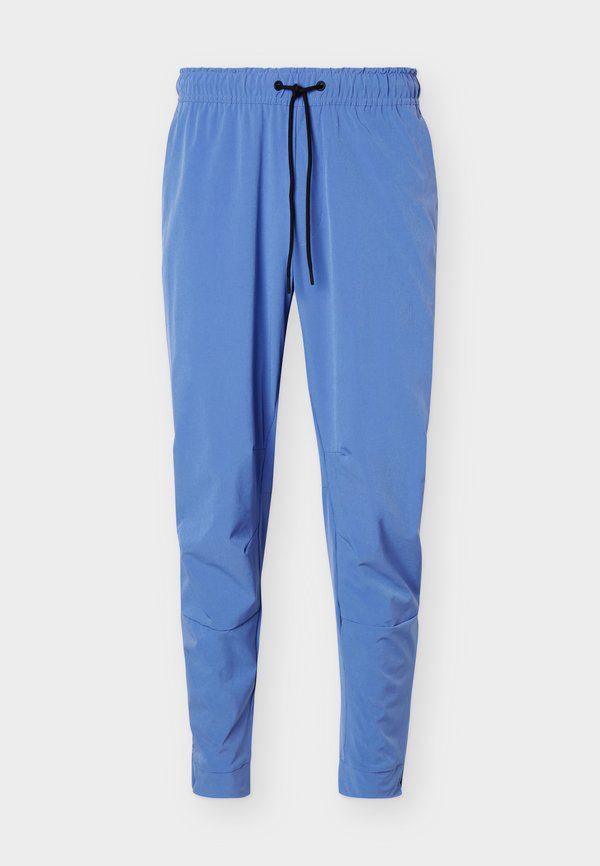 Nike Performance UNLIMITED - Tracksuit bottoms - indigo storm/black