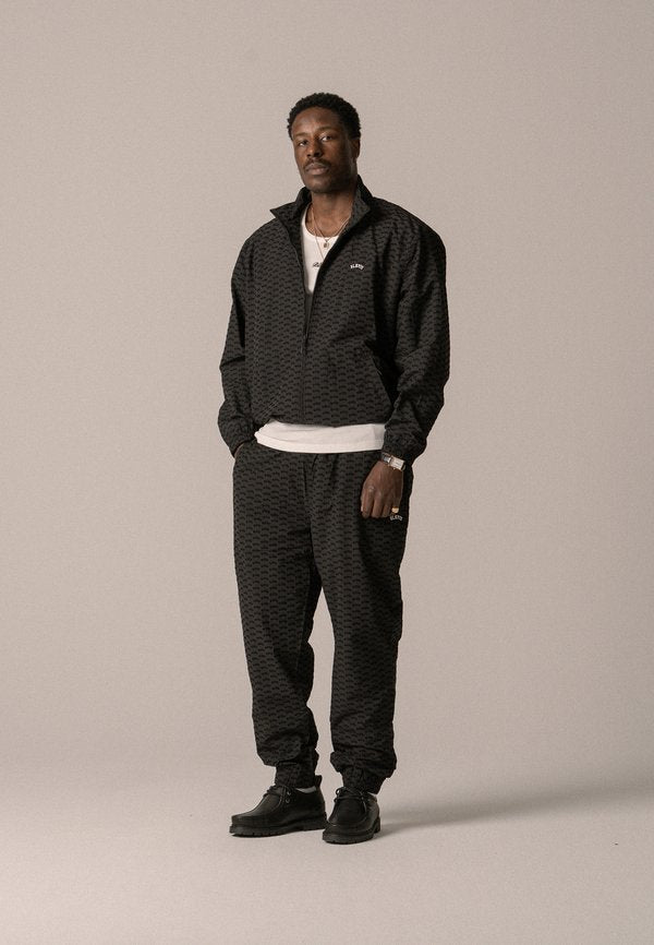 BLKVIS ALLOVER TRACK PANTS UNISEX