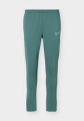 Türkisfarbene Slim-Fit-Sporthose mit elastischem Bund und weißem Nike Swoosh-Logo am oberen linken Bein.
