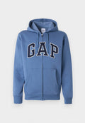 Blauer Kapuzenpullover mit Reißverschluss, Fronttaschen, Kordelzugkapuze und großen "GAP"-Buchstaben in Marineblau und Weiß über der Brust.