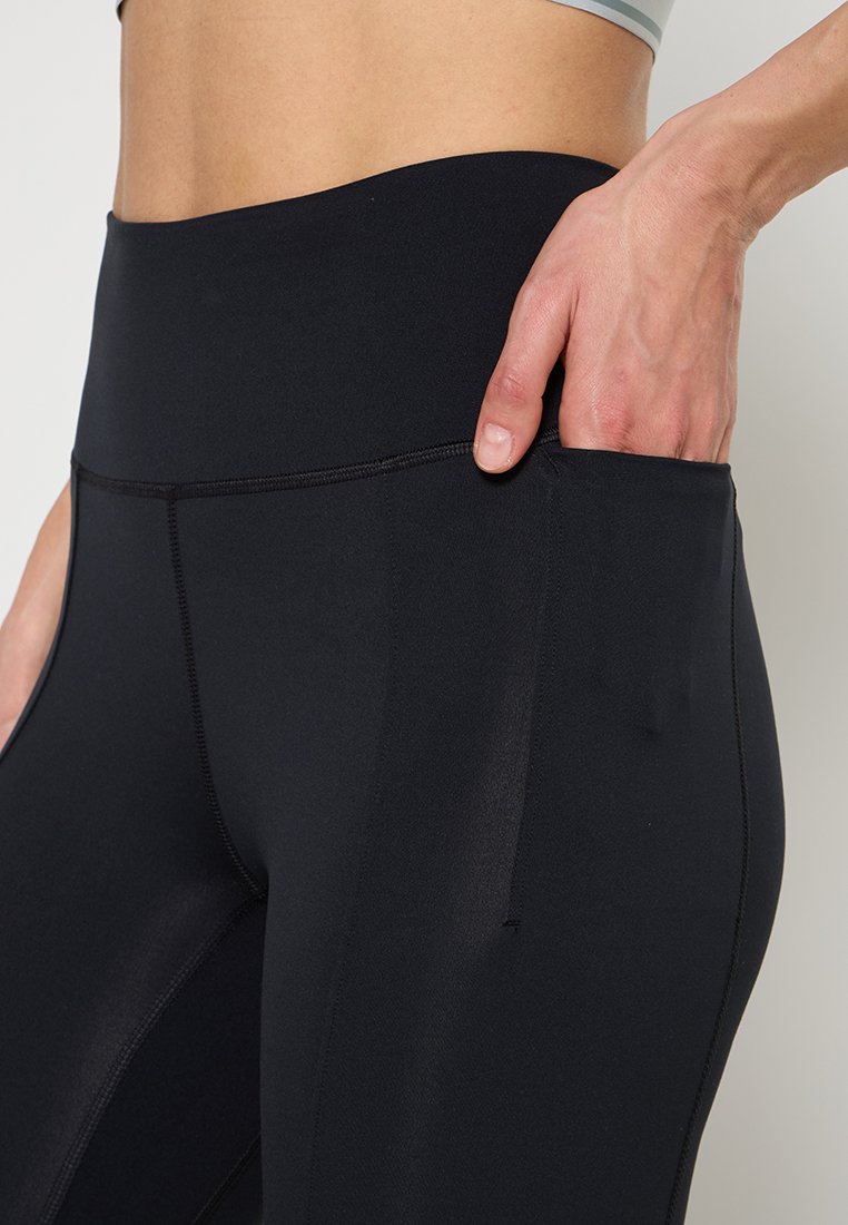 Under Armour MERIDIAN KICK FLARE PANT-GRN