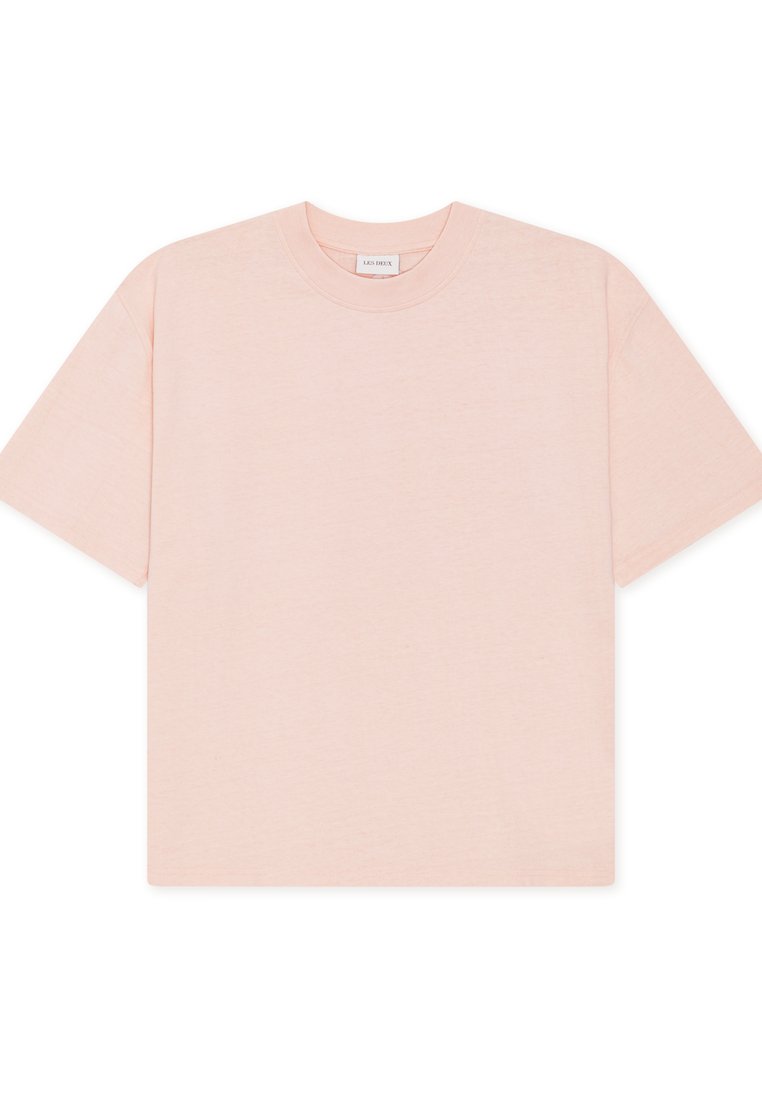 Hellrosa übergroßes T-Shirt aus weicher Baumwolle, mit kurzen Ärmeln und rundem Ausschnitt, in einem einfachen, nahtlosen Design.