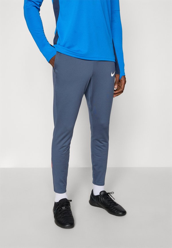 Nike Performance STRIKE PANT - Tracksuit bottoms - thunder blue/bright crimson/white